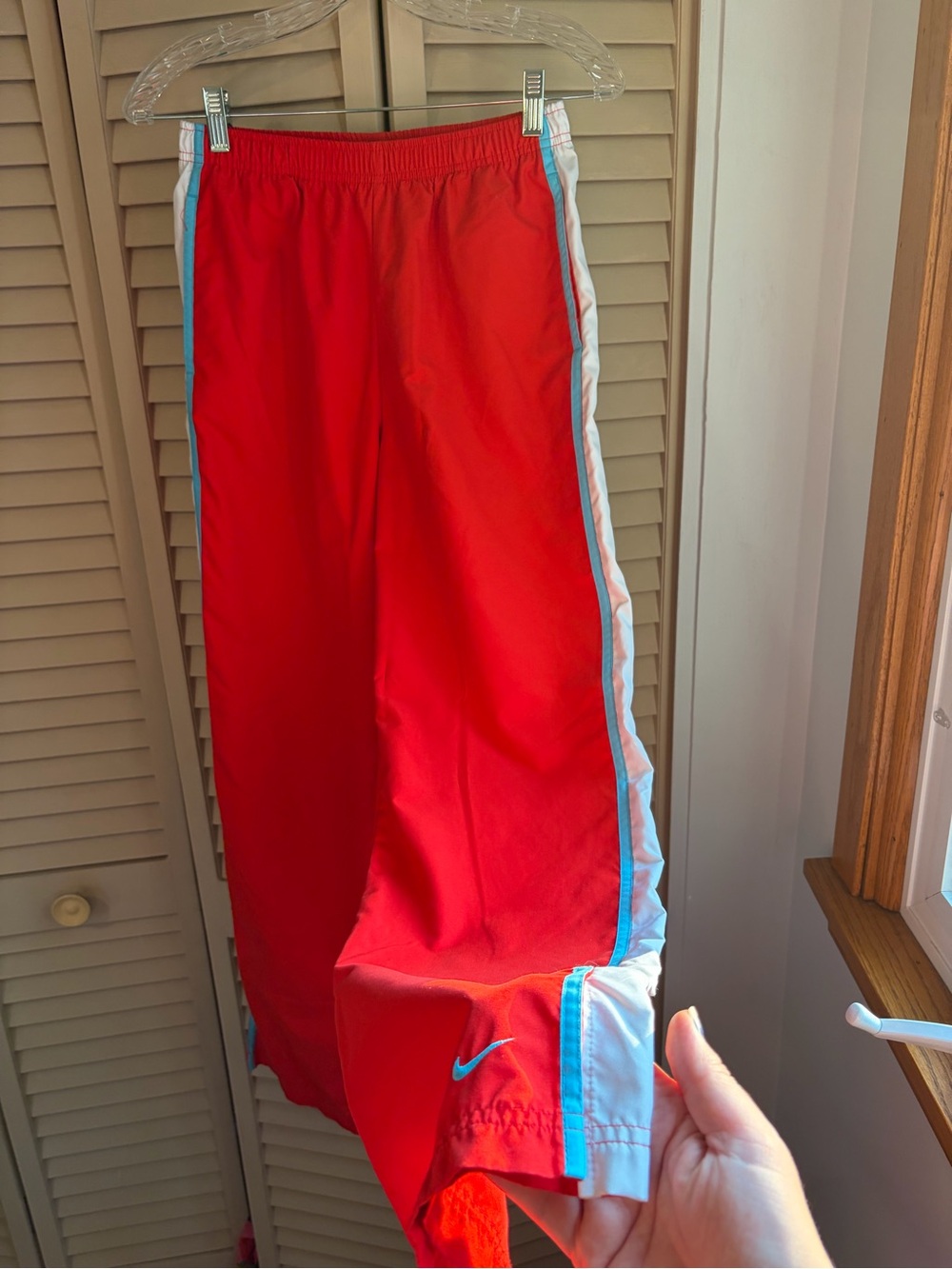 Nike Red Kids Joggers with White and Light Blue Side Stripes